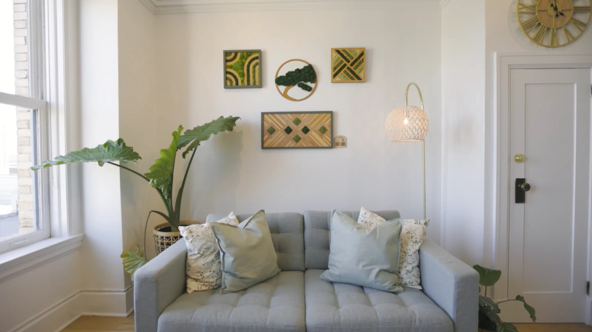 Session room with couch, wall art, and plant
