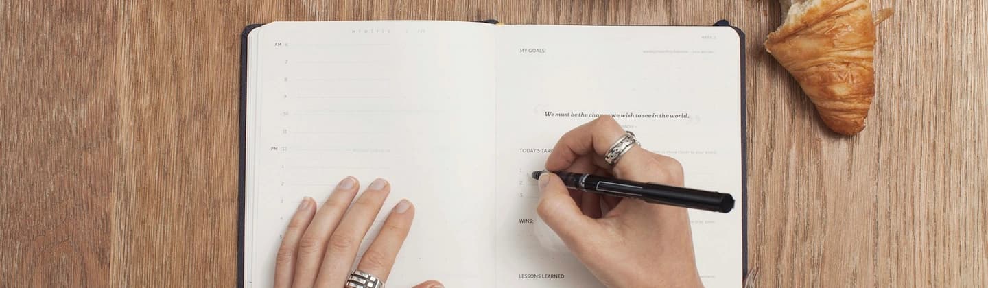 Blog hero — writing at a calm desk