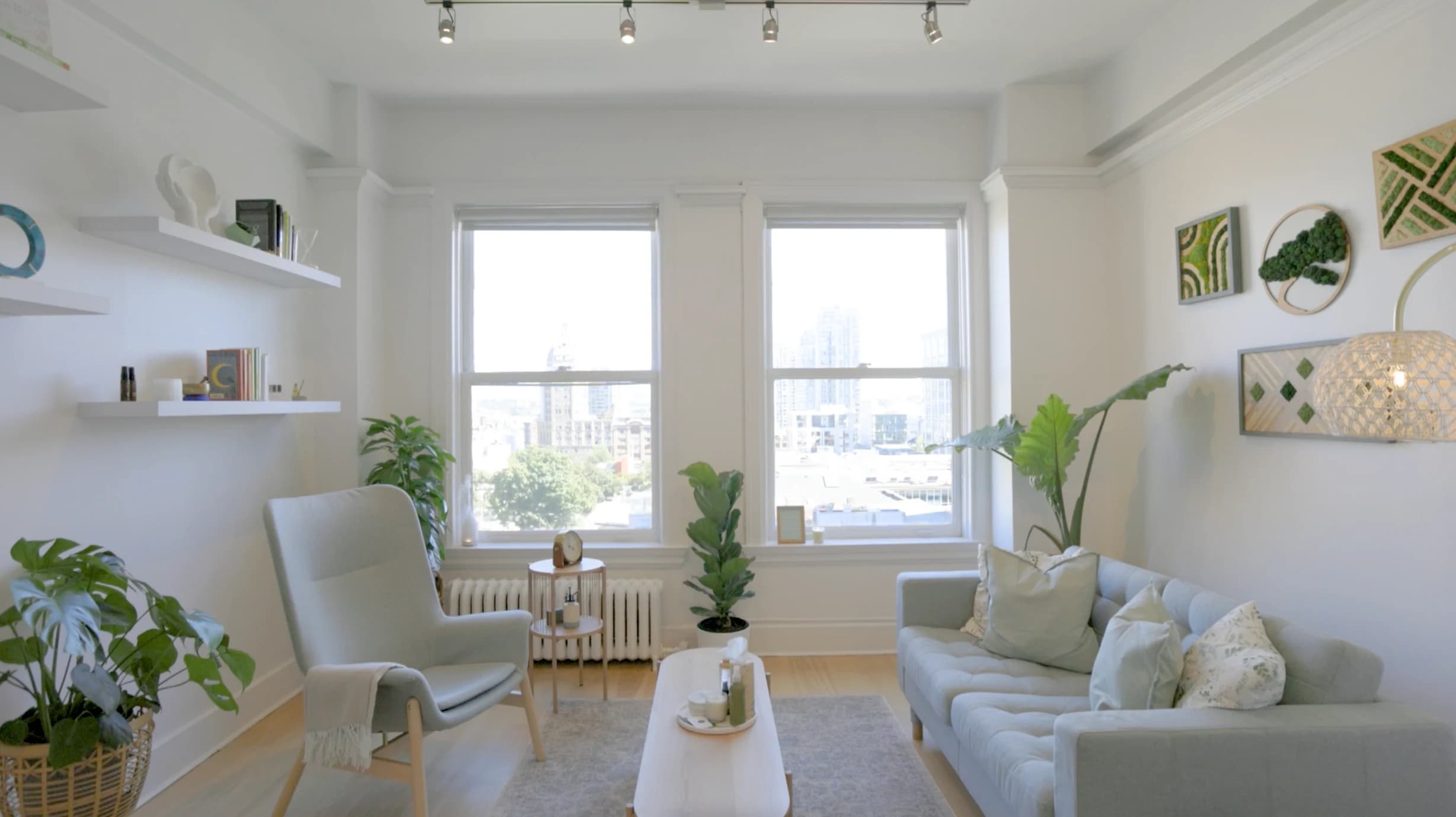 Wellness Talks Health Centre therapy office — couch, plants, and natural light in our Downtown Vancouver clinic